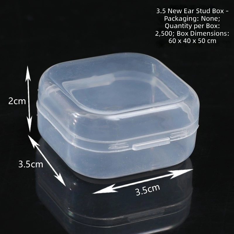 Mini square jewelry boxes filled with earrings and rings